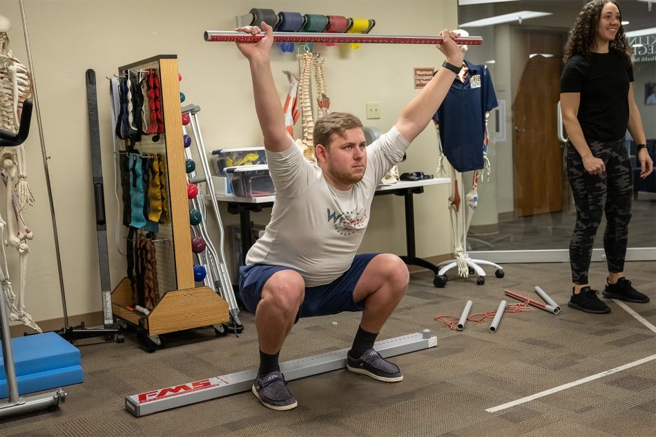Photograph of Master of Science in Athletic Training students working in a Franklin College classroom.