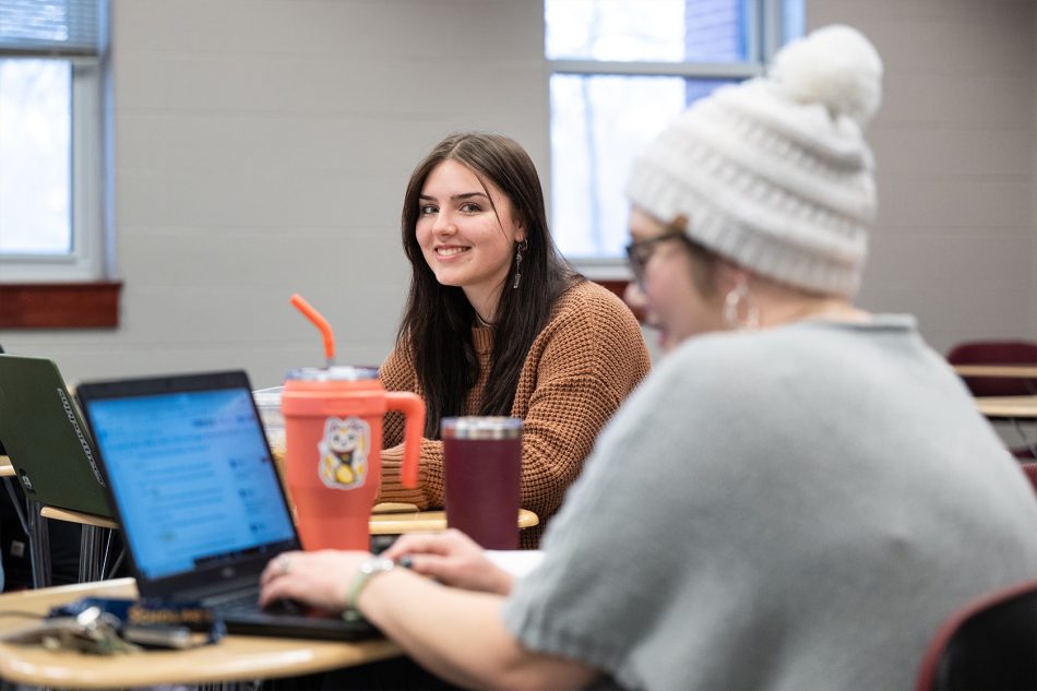 Photograph of a Franklin College student in a classroom.