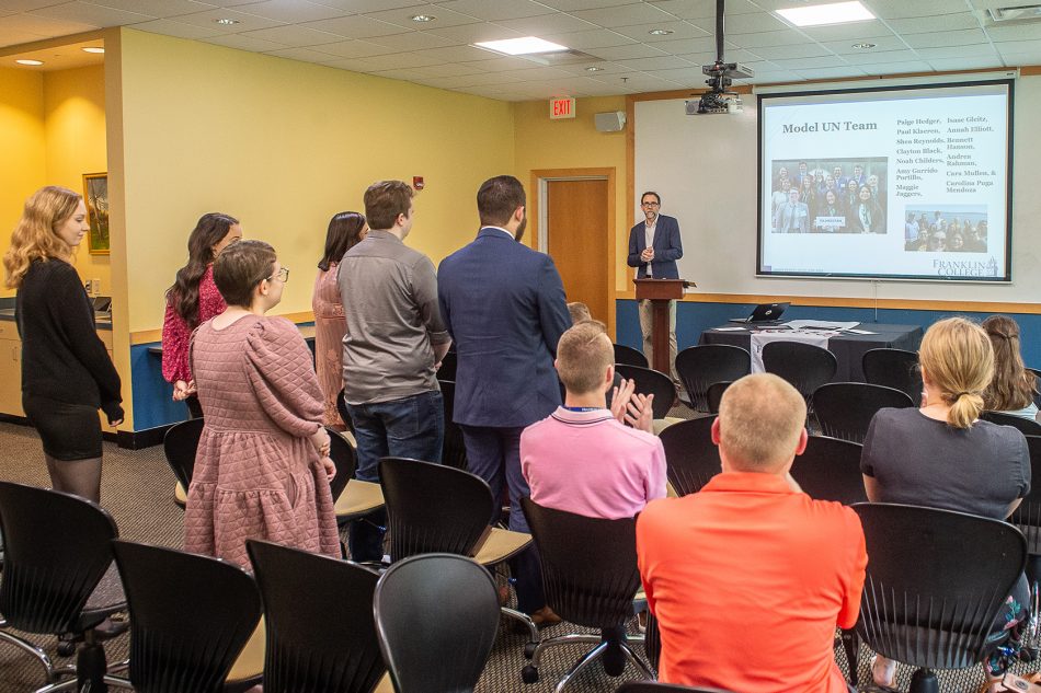 Photograph of members of the Franklin College Model UN Team being recognized during an awards presentation on campus.