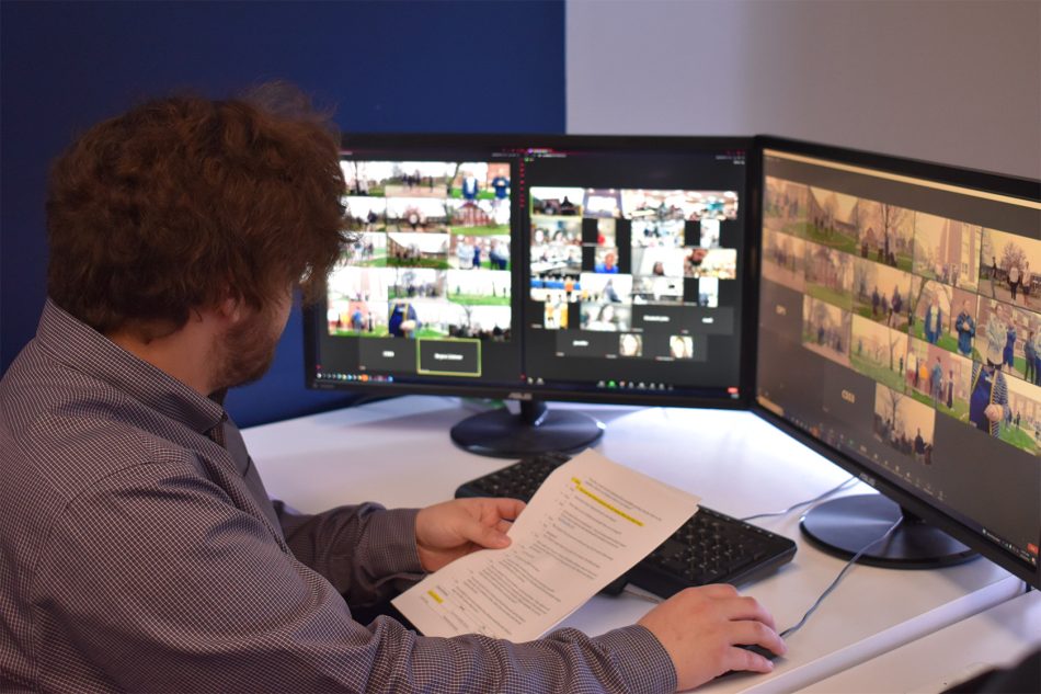 Photograph of a person working at a bank of monitors on the Franklin College campus.